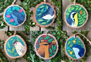 group of hand painted bird ornaments